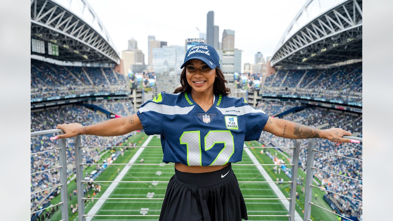 PHOTOS Jordan Chiles Raises The 12 Flag Before The Seahawks Face The Dolphins