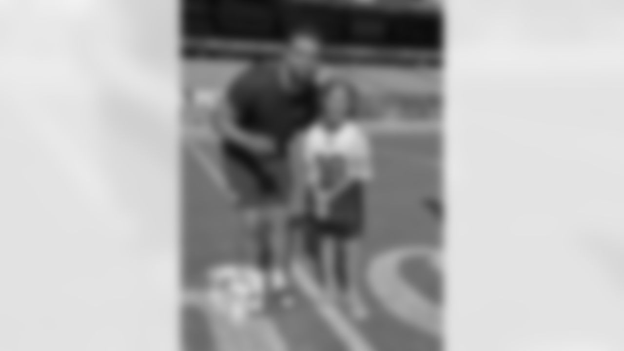 QB Caleb Williams and national Anthem singer Sophia Hope