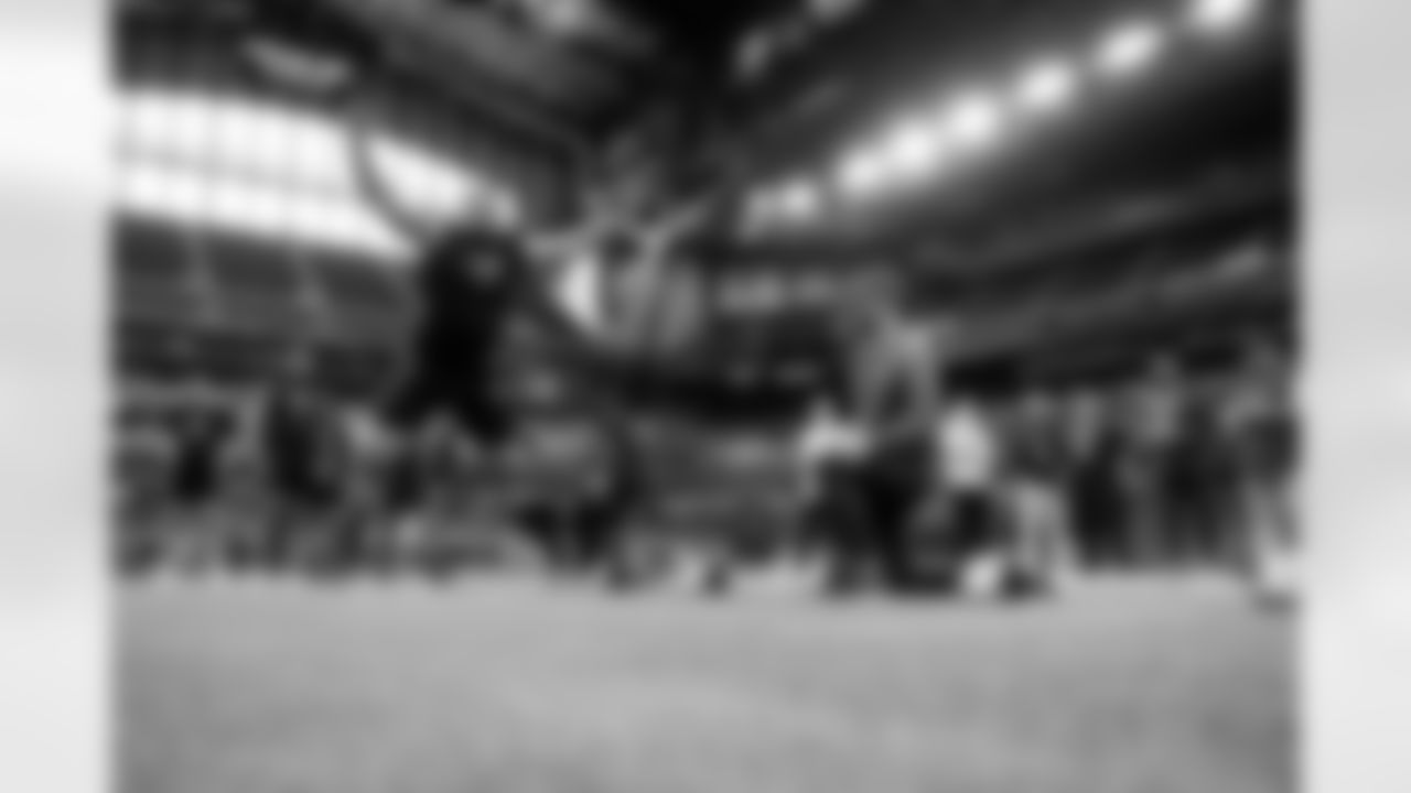 Georgia offensive lineman Dylan Fairchild participates in the broad jump at the NFL football scouting combine in Indianapolis, Sunday, March 2, 2025. (Brooke Sutton via AP)