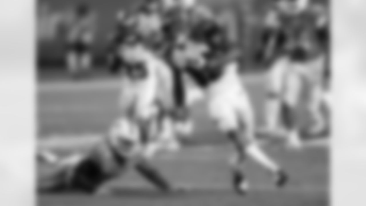 Cincinnati Bengals wide receiver Marvin Jones (82) catches a pass and runs past Miami Dolphins cornerback Dimitri Patterson (24) on a 50 yard touchdown nullified by an offensive holding penalty during the NFL week 9 football game against the Miami Dolphins on Thursday, Oct. 31, 2013 in Miami Gardens, Fla.. The Dolphins won the game 22-20 in overtime. (AP Photo/Paul Spinelli)