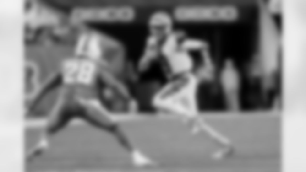 Cincinnati Bengals quarterback Joe Burrow (9) runs with the ball during an NFL football game against the Miami Dolphins, Thursday, Sept. 29, 2022, in Cincinnati. The Bengals won 27-15. (Aaron Doster via AP)