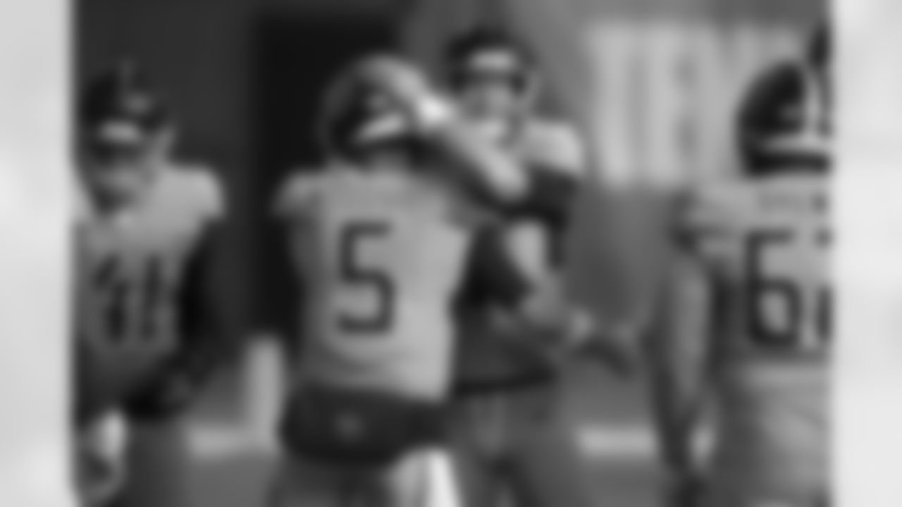 Tennessee Titans quarterback Logan Woodside (5) greets quarterback Ryan Tannehill before an NFL football game against the Cleveland Browns Sunday, Dec. 6, 2020, in Nashville, Tenn. (AP Photo/Wade Payne)