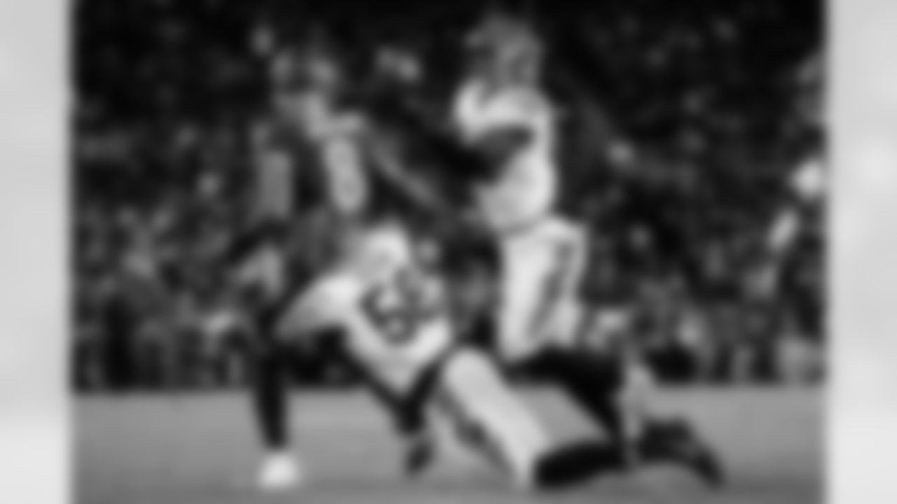 DEs Joseph Ossai and Cedric Johnson force a turnover during Thanksgiving Week 13 against the Baltimore Ravens, Thursday, Nov. 27, 2025.