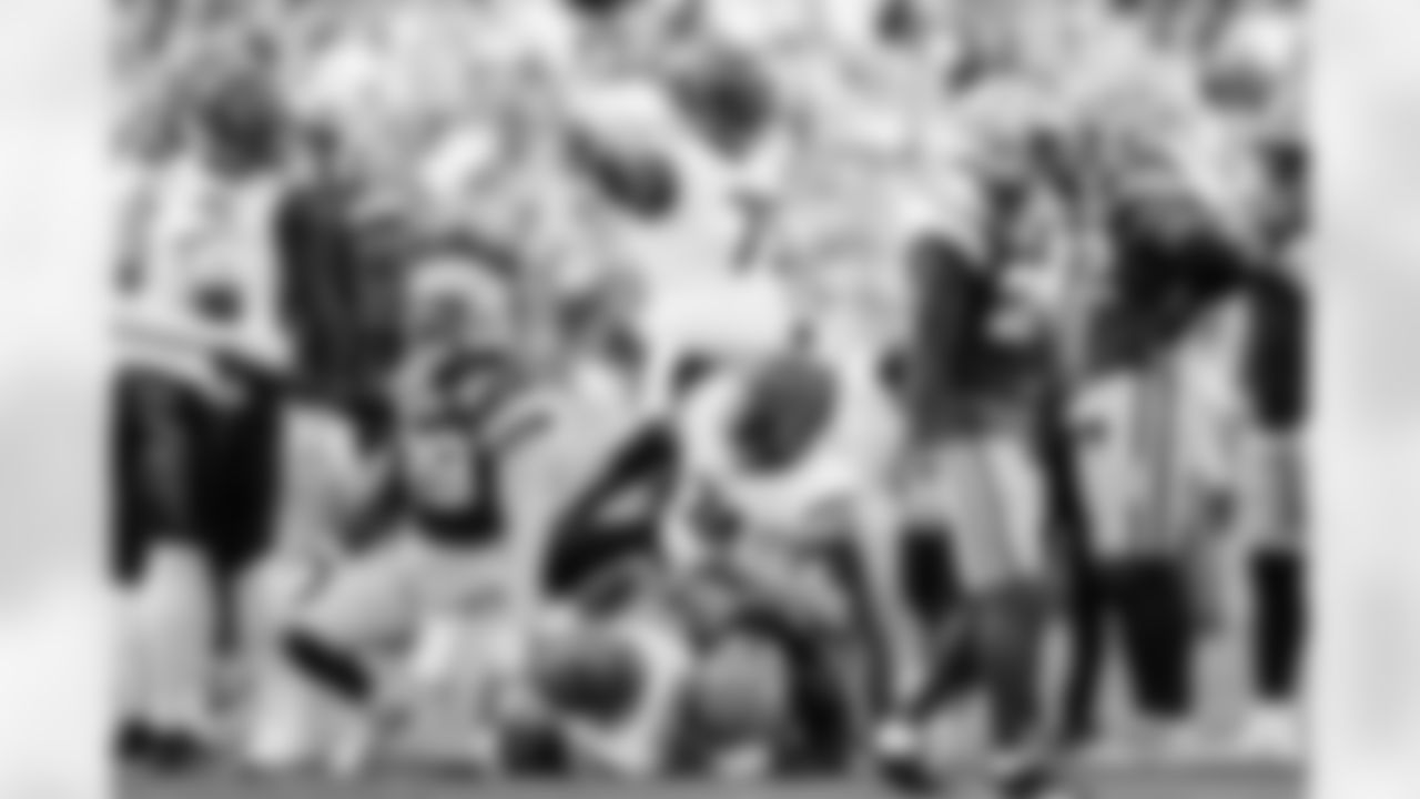 RB Chase Brown plunges for a first down during Week 6 against the Packers in Green Bay, Sunday, Oct. 12, 2025.