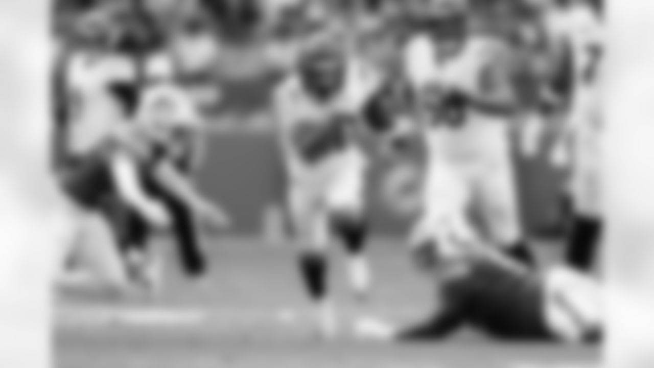 RB Chase Brown carries the ball during Week 16 against the Miami Dolphins at Hard Rock Stadium, Sunday, Dec. 21, 2025.