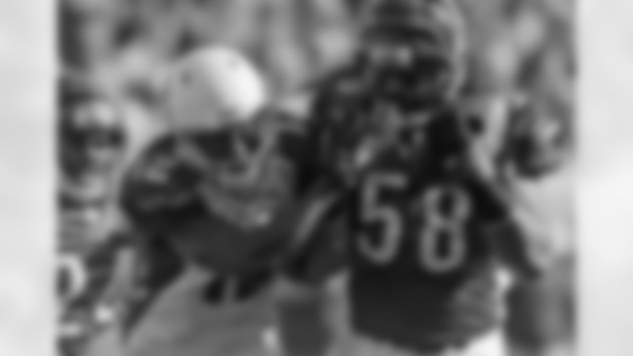 Cincinnati Bengals linebacker Rey Maualuga (58) intercepts a pass intended for Arizona Cardinals wide receiver Andre Roberts (12) in the first half of an NFL football game, Saturday, Dec. 24, 2011, in Cincinnati. (AP Photo/Tony Tribble)