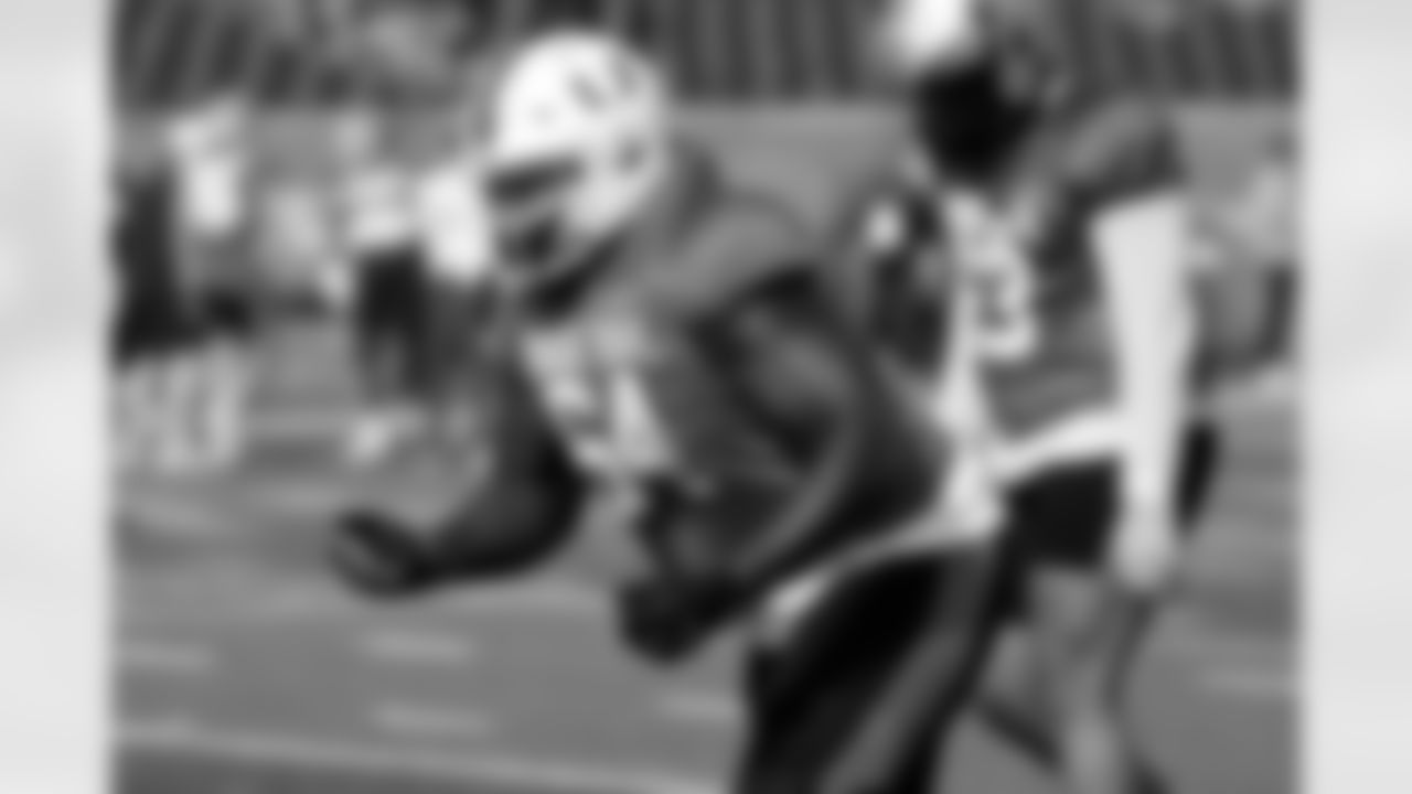 National team offensive lineman Jalen Rivers of Miami (64) runs through drills during practice for the Senior Bowl NCAA college football game, Wednesday, Jan. 29, 2025, in Mobile, Ala. (AP Photo/Butch Dill)