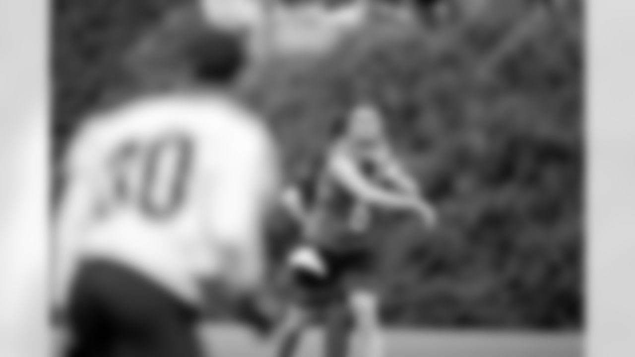 QB Jake Browning throws a pass to RB Chase Brown during Phase Two of offseason workouts at Kettering Health Practice Fields, Tuesday, May 6, 2025.