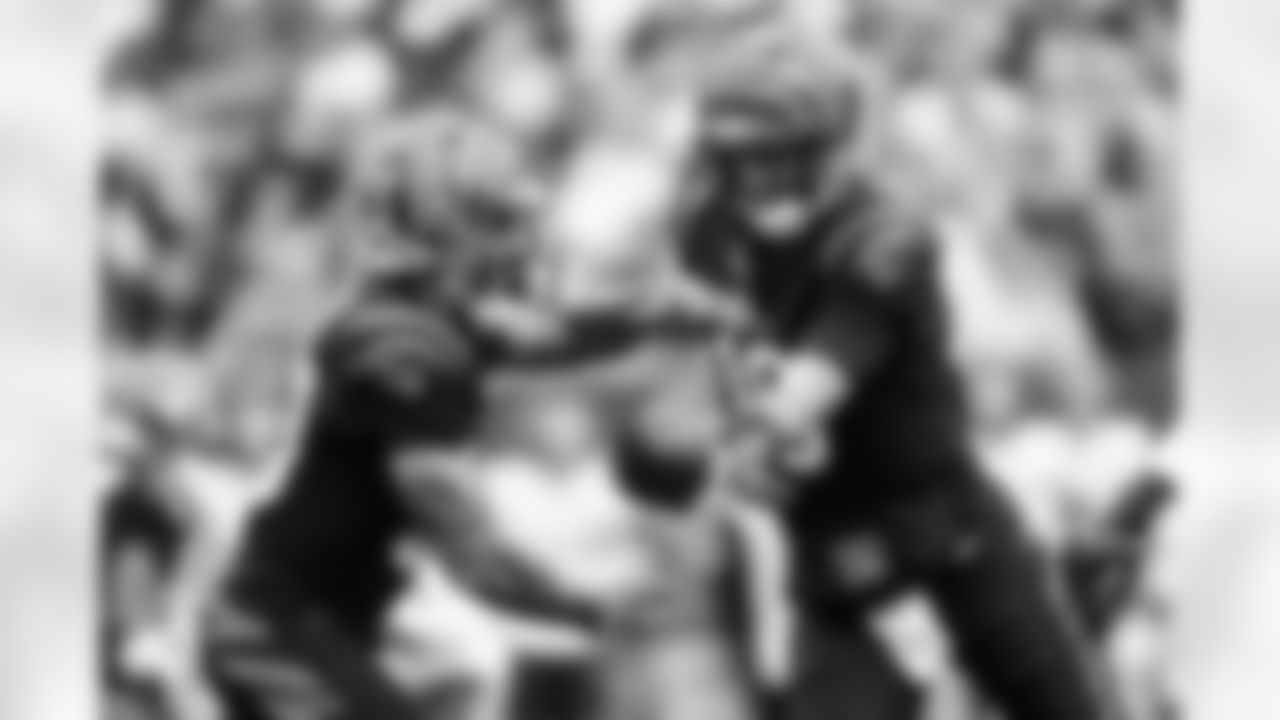 QB Joe Flacco hands the ball off to RB Chase Brown during Week 9 against the Chicago Bears at Paycor Stadium, Sunday, Nov. 2, 2025.