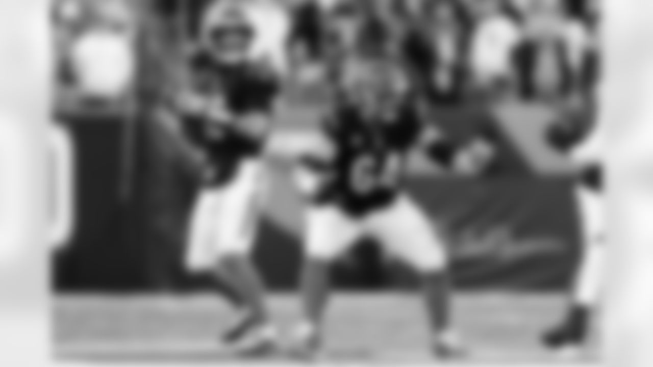 QB Joe Flacco looks to pass while C Ted Karras blocks during Week 12 against the New England Patriots at Paycor Stadium, Sunday, Nov. 23, 2025.