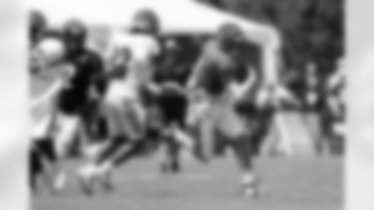 QB Joe Burrow tucks and runs during Day 9 of training camp at Kettering Health Practice Fields, Sunday, Aug. 3, 2025.