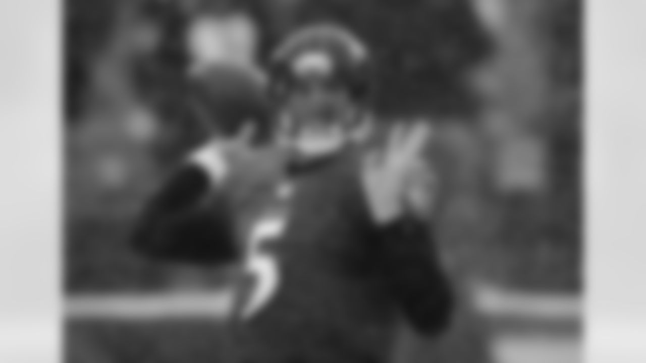 Baltimore Ravens quarterback Joe Flacco warms up as snow falls before an NFL football game against the Minnesota Vikings, Sunday, Dec. 8, 2013, in Baltimore. (AP Photo/Nick Wass)