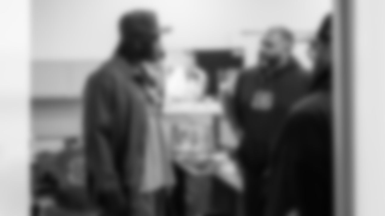 EDGE Shemar Stewart speaks with defensive line coach Jerry Montgomery at Paycor Stadium.