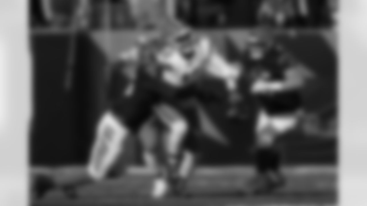 Cleveland Browns quarterback Shedeur Sanders (12) fumbles the ball while being sacked by Cincinnati Bengals defensive end Cam Sample, left, which the Bengals recovered, during the first half of an NFL football game, Sunday, Jan. 4, 2026, in Cincinnati.