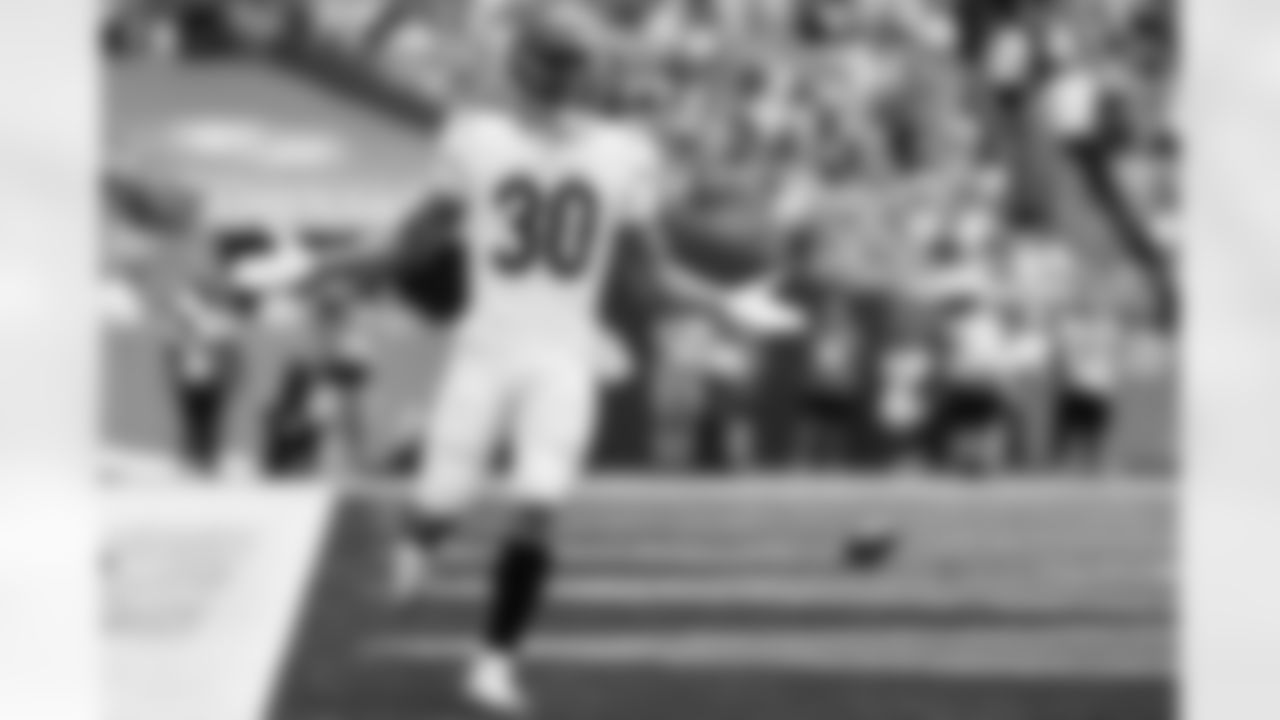 RB Chase Brown celebrates a touchdown during Week 16 against the Miami Dolphins at Hard Rock Stadium, Sunday, Dec. 21, 2025.