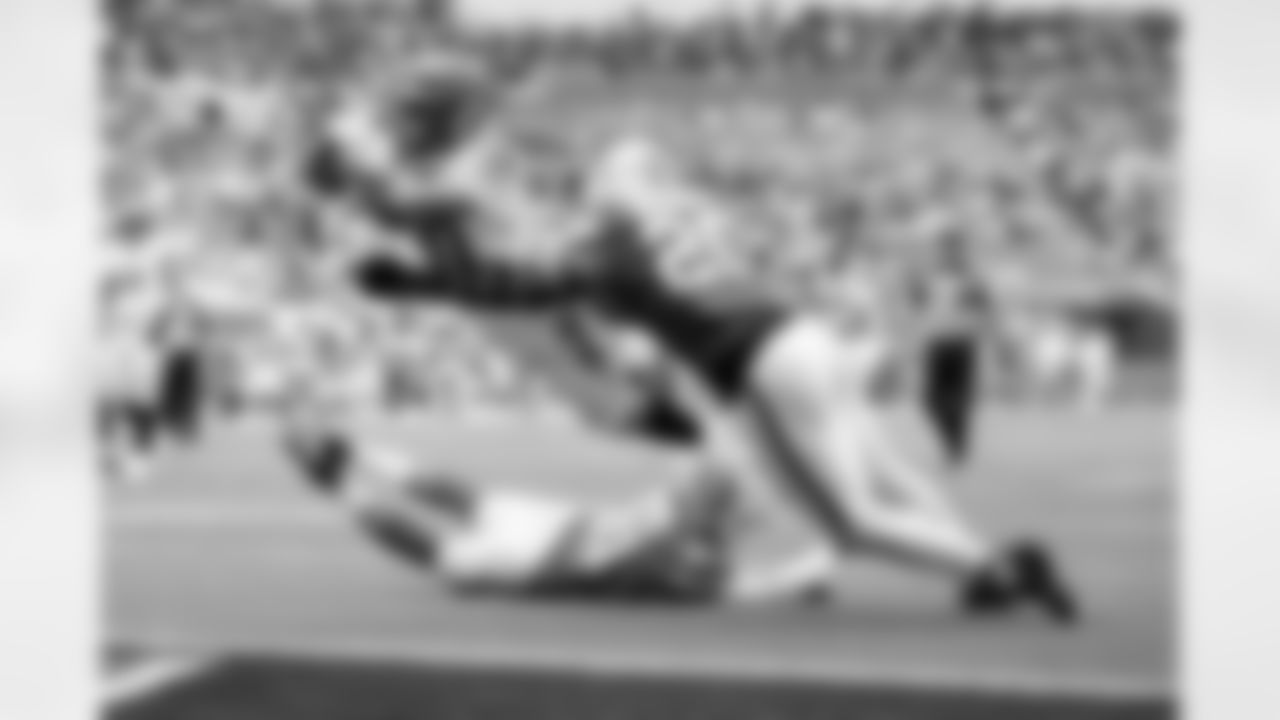 RB Chase Brown scores a touchdown during Week 16 against the Miami Dolphins at Hard Rock Stadium, Sunday, Dec. 21, 2025.