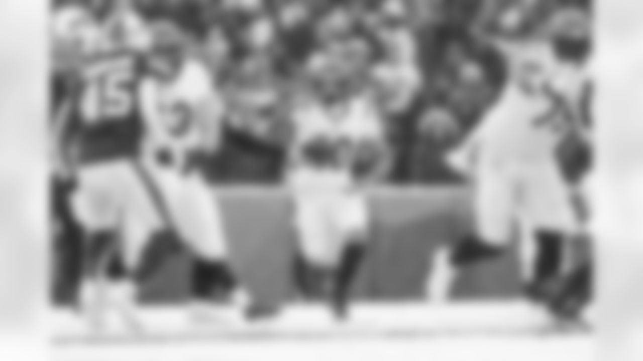 RB Chase Brown takes a handoff during Week 14 against the Buffalo Bills, Sunday, Dec. 7, 2025.