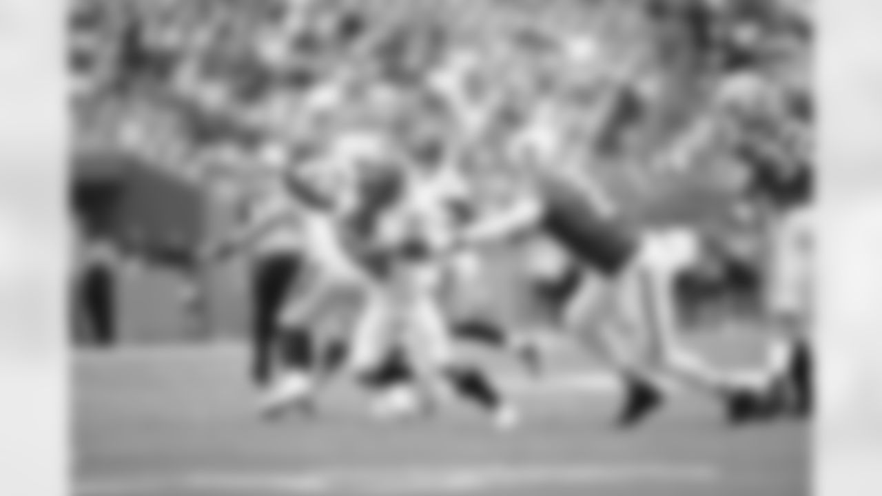 RB Chase Brown jukes a defender during Week 16 against the Miami Dolphins at Hard Rock Stadium, Sunday, Dec. 21, 2025.