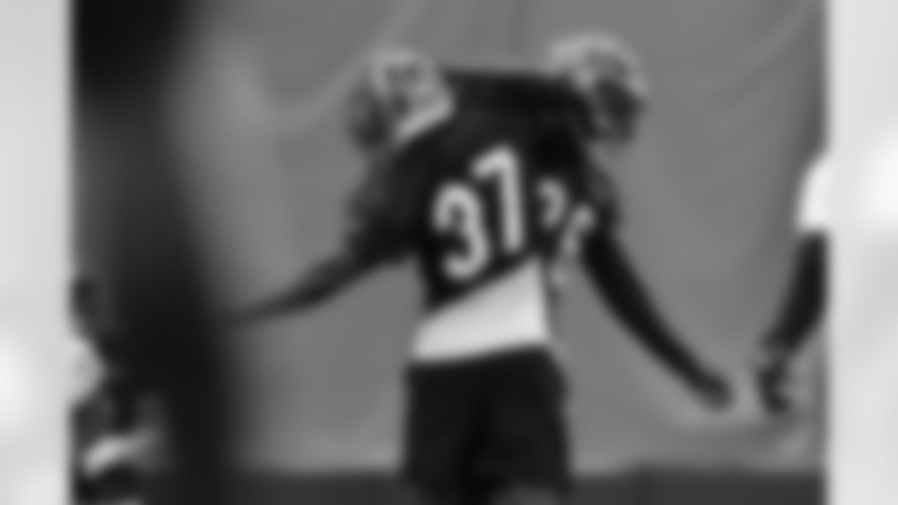 DBs PJ Jules and Tycen Anderson celebrate a play during practice at the IEL Indoor Facility, Thursday, Sept. 25, 2025.