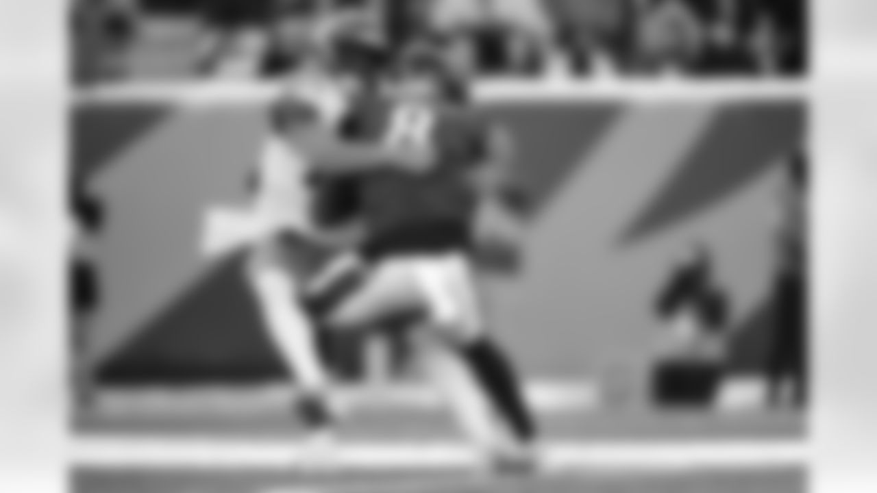 Baltimore Ravens quarterback Lamar Jackson (8) is sacked by Cincinnati Bengals linebacker Demetrius Knight Jr., left, during the first half of an NFL football game, Sunday, Dec. 14, 2025, in Cincinnati. (AP Photo/Carolyn Kaster)