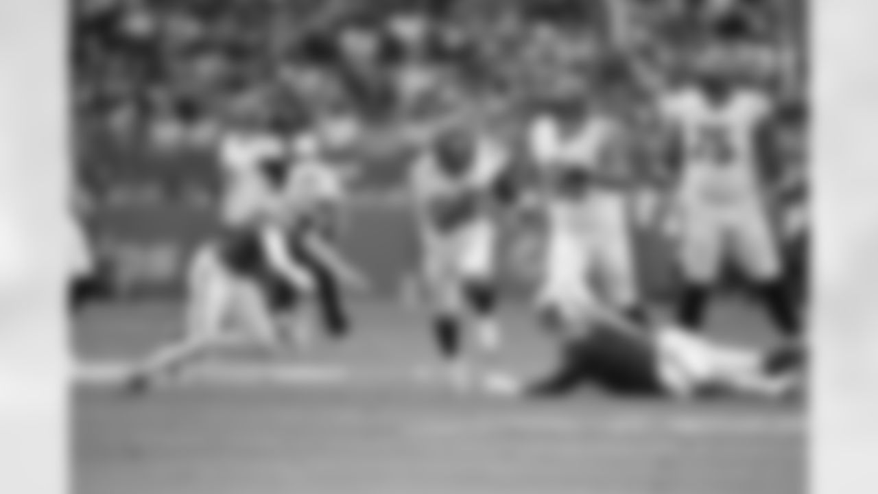 RB Chase Brown carries the ball during Week 16 against the Miami Dolphins at Hard Rock Stadium, Sunday, Dec. 21, 2025.