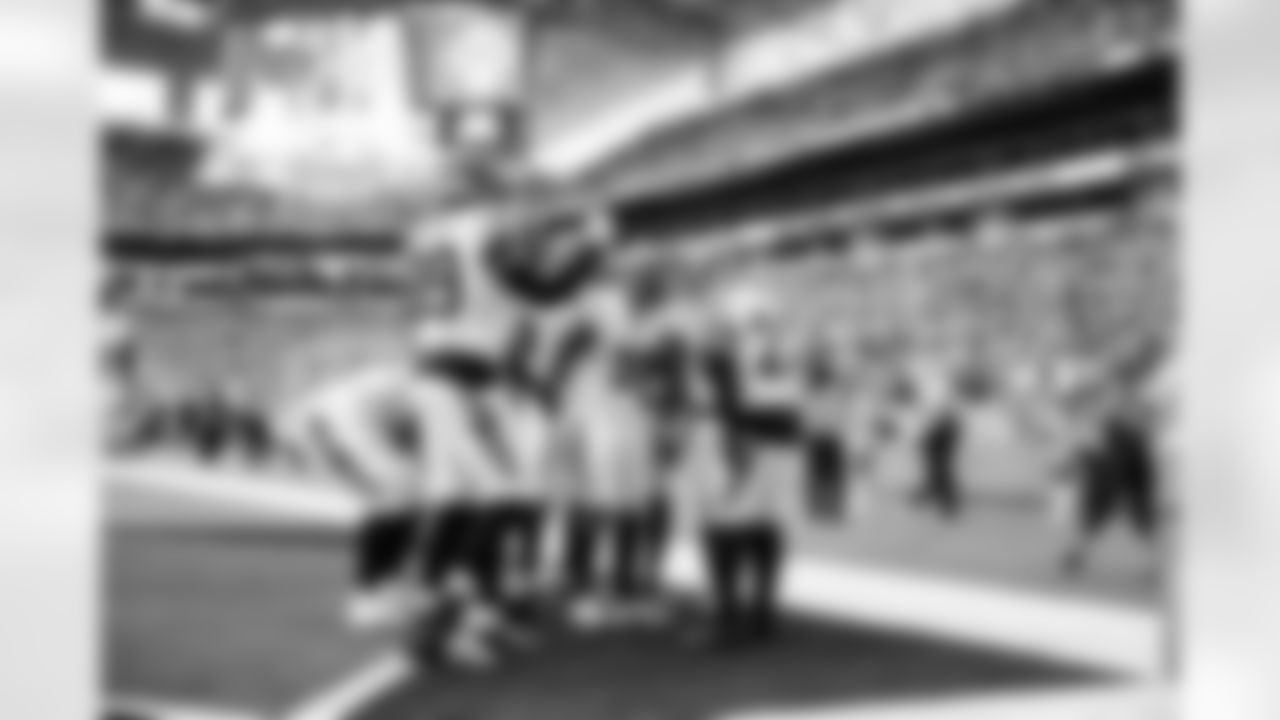 The Bengals defense celebrates a play during Week 16 against the Miami Dolphins at Hard Rock Stadium, Sunday, Dec. 21, 2025.