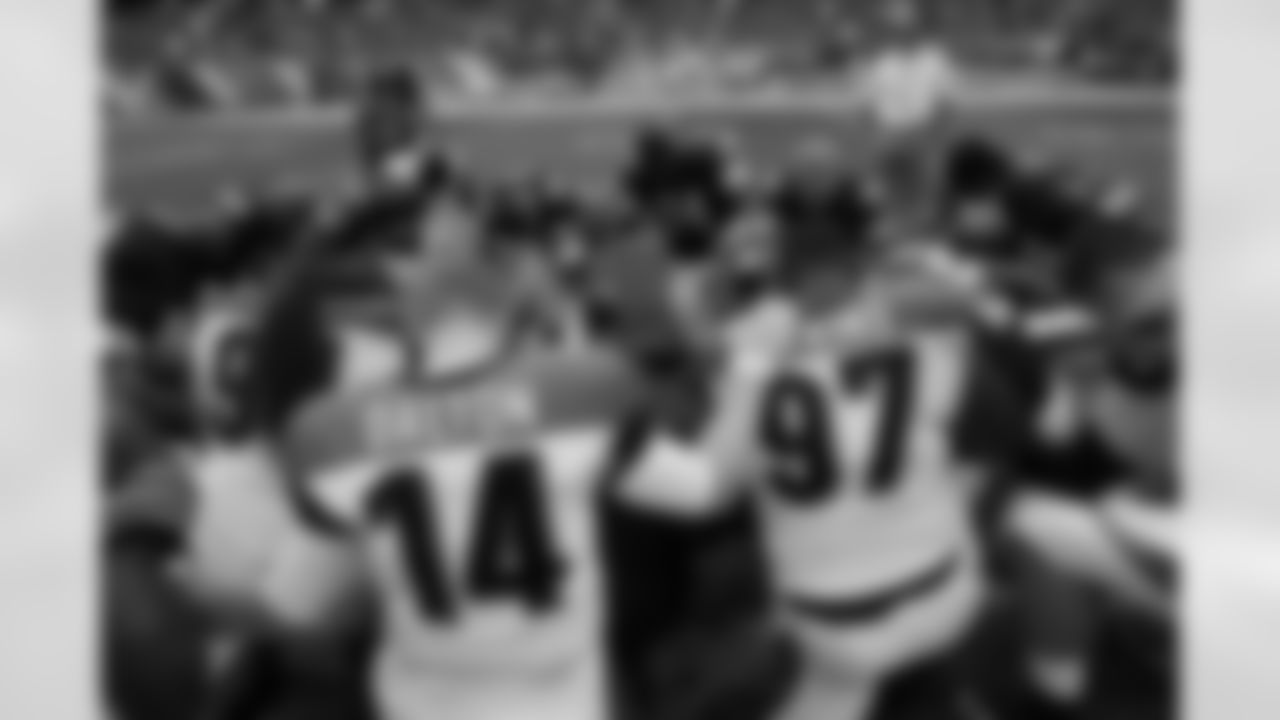 The Cincinnati Bengals and Chicago Bears gather for a prayer after an NFL football game, Sunday, Sept. 8, 2013, in Chicago. The Bears won 24-21. (AP Photo/Charles Rex Arbogast)
