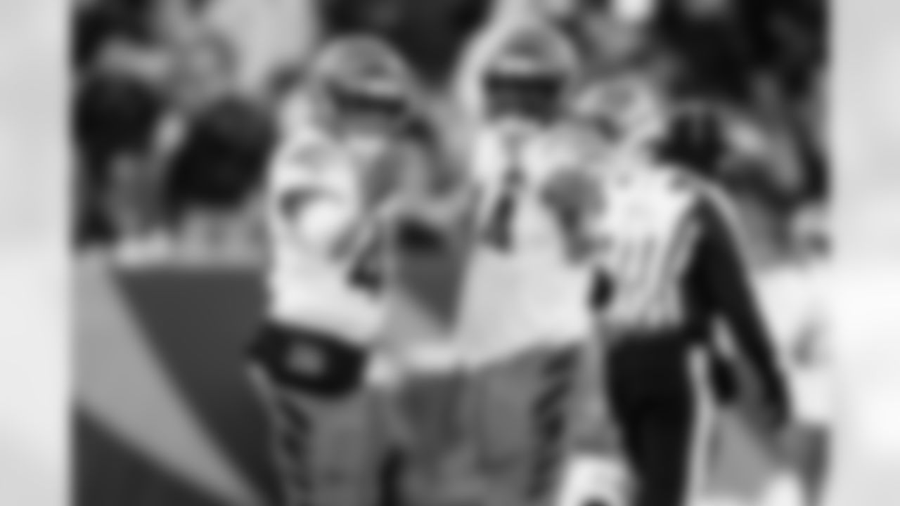 LBs Barrett Carter and Demetrius Knight Jr. celebrate Knight's sack during Week 15 against the Baltimore Ravens at Paycor Stadium, Sunday, Dec. 14, 2025.