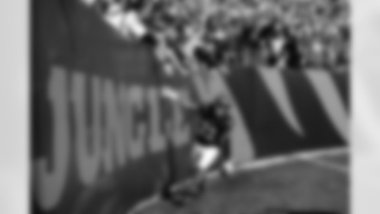 Cincinnati Bengals safety Geno Stone celebrates after returning an interception for a touchdown during the first half of an NFL football game against the New England Patriots, Sunday, Nov. 23, 2025, in Cincinnati.