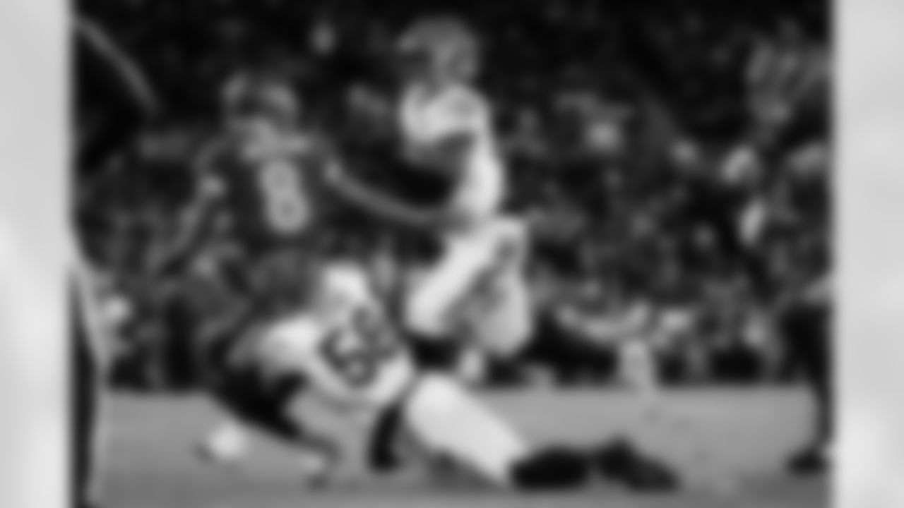 DE Cedric Johnson recovers a fumble forced by DE Joseph Ossai during Week 13 against the Baltimore Ravens, Thursday, Nov. 27, 2025.