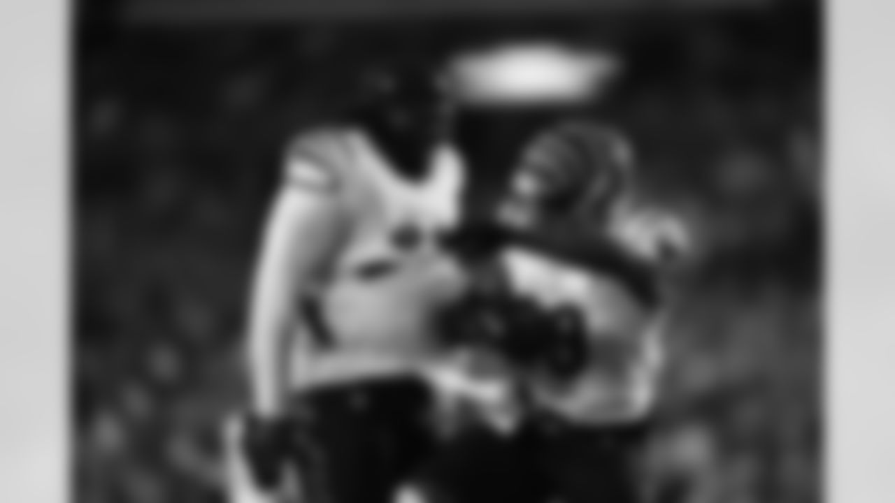 DT T.J. Slaton Jr. and LB Barrett Cater celebrate Carter's interception in the Preseason Week 2 game against the Washington Commanders, Monday, Aug. 18, 2025.