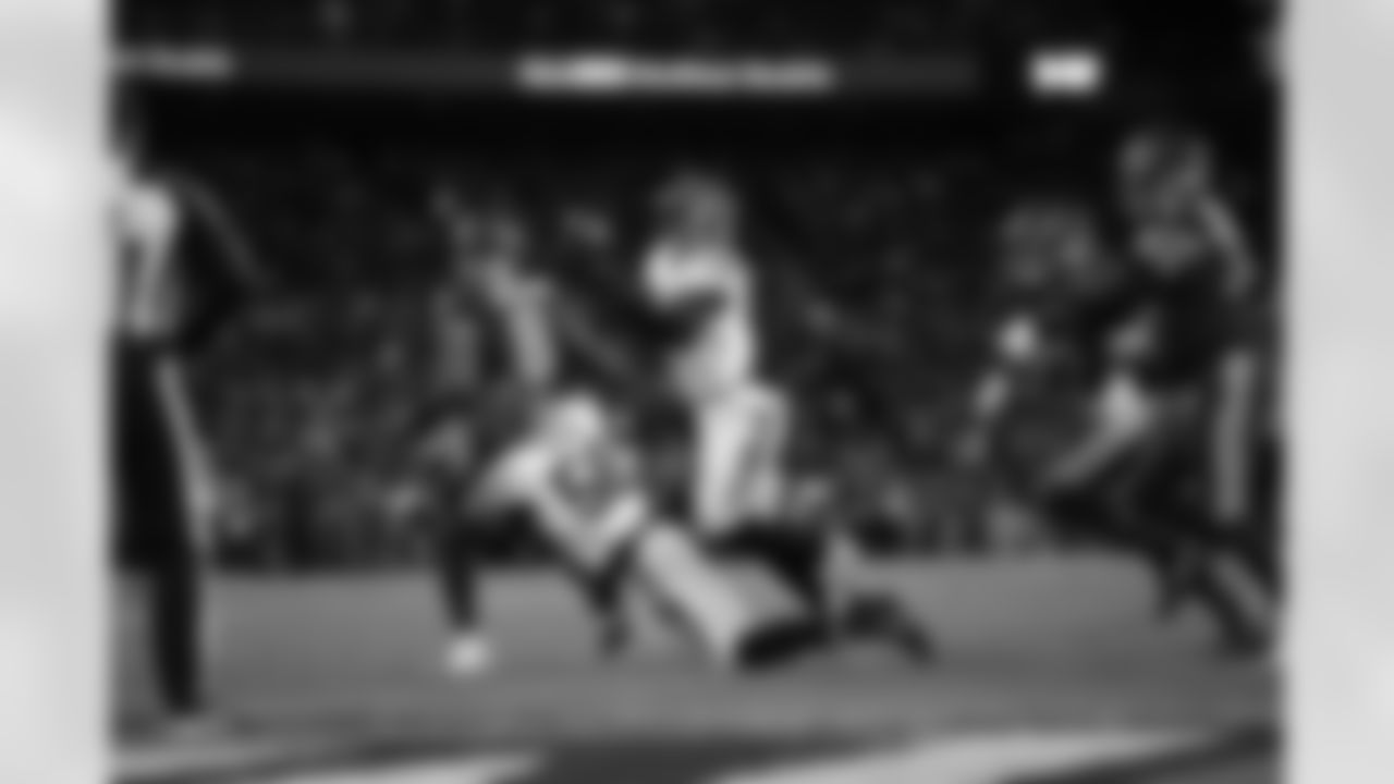 DE Joseph Ossai hits Lamar Jackson as DE Cedric Johnson recovers the fumble during Week 13 against the Baltimore Ravens, Thursday, Nov. 27, 2025.