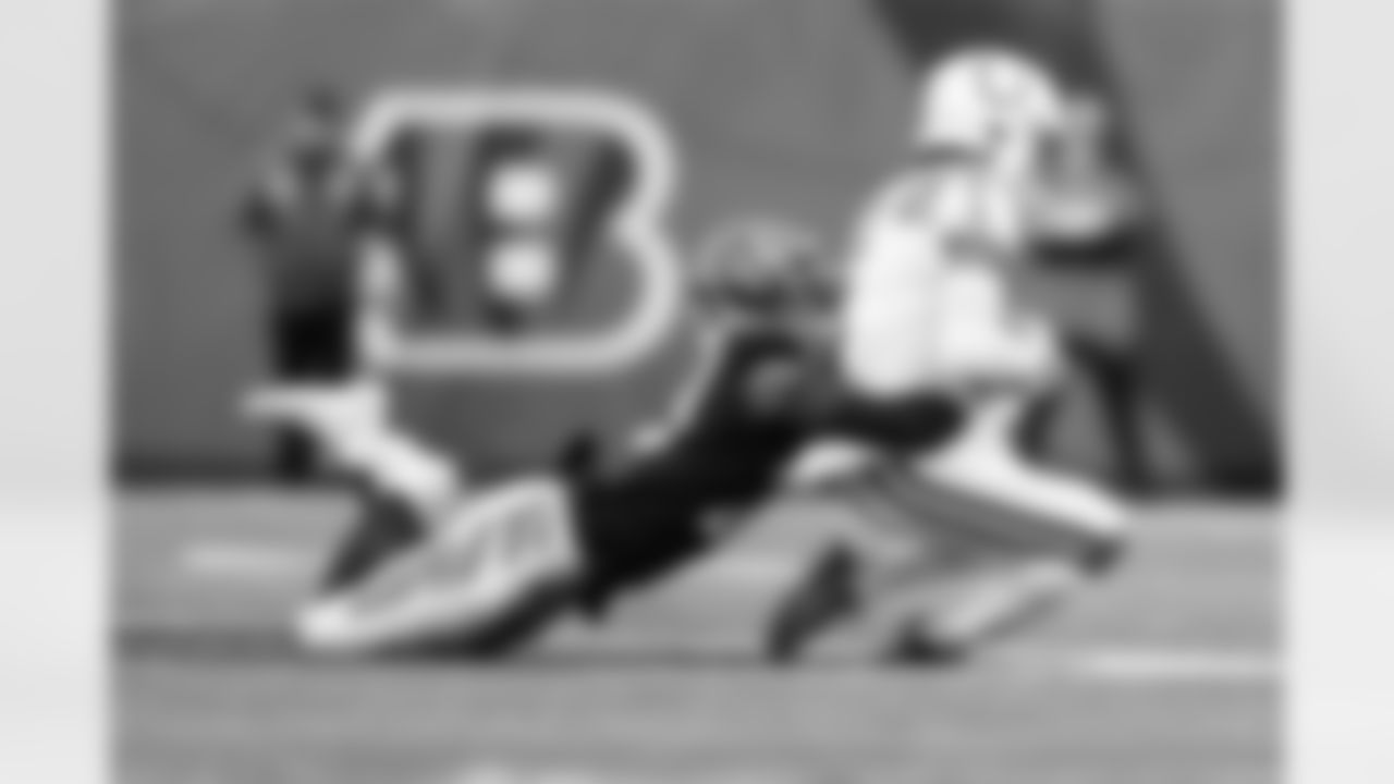 CB Dax Hill makes a tackle against the Indianapolis Colts at Paycor Stadium, Sunday, December 10, 2023.