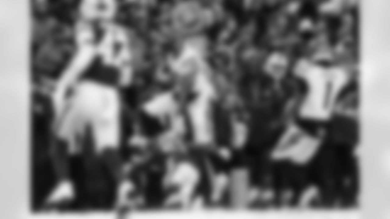 TE Noah Fant hurdles a defender during Week 14 against the Buffalo Bills, Sunday, Dec. 7, 2025.