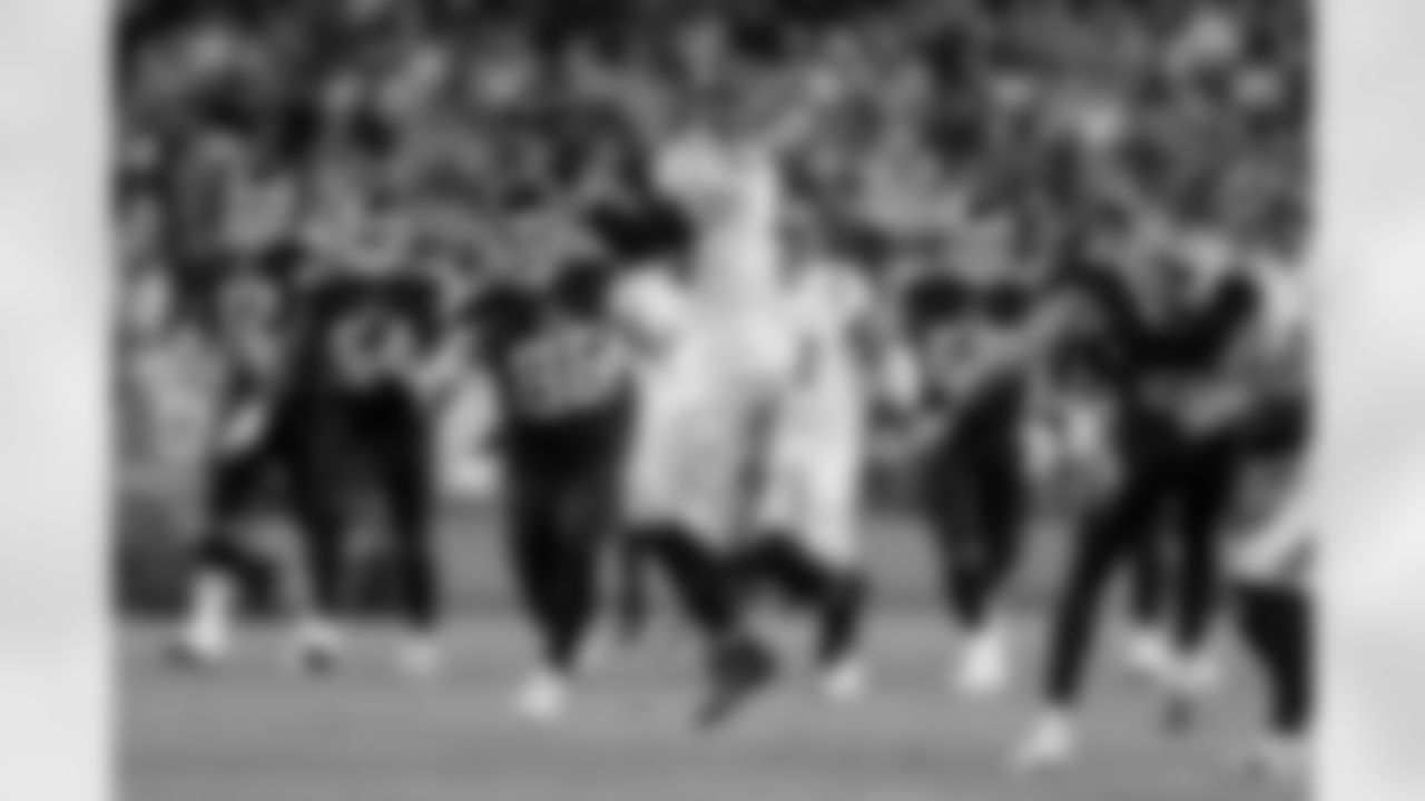 Cincinnati Bengals linebacker Logan Wilson intercepts a pass during an NFL divisional round playoff football game against the Tennessee Titans, Saturday, Jan. 22, 2022, in Nashville, Tenn. The Bengals won 19-16. (Aaron Doster via AP)