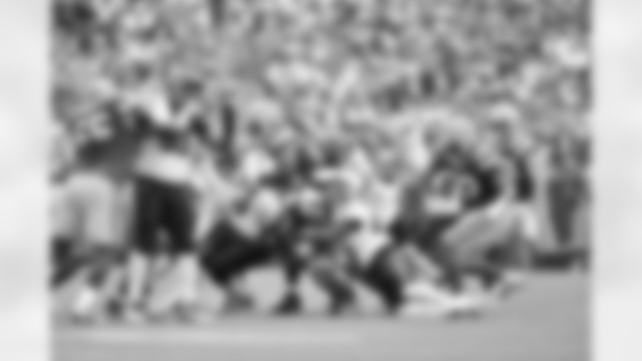 The Bengals defense makes a tackle during Week 6 against the Packers in Green Bay, Sunday, Oct. 12, 2025.