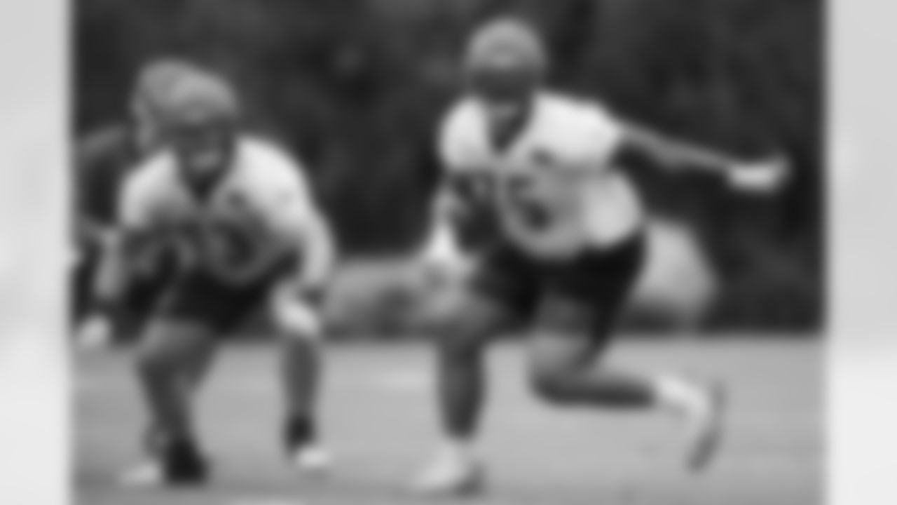 G Dylan Fairchild and OT Orlando Brown Jr. during OTAs at Kettering Health Practice Fields, Tuesday, May 27, 2025.