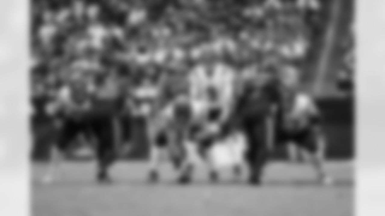 Cincinnati Bengals quarterback Joe Burrow (9) stands under center during an NFL game against the Arizona Cardinals, Sunday, Oct. 8, 2023, in Glendale, Ariz. The Bengals defeated the Cardinals 34-20. (Cooper Neill via AP)