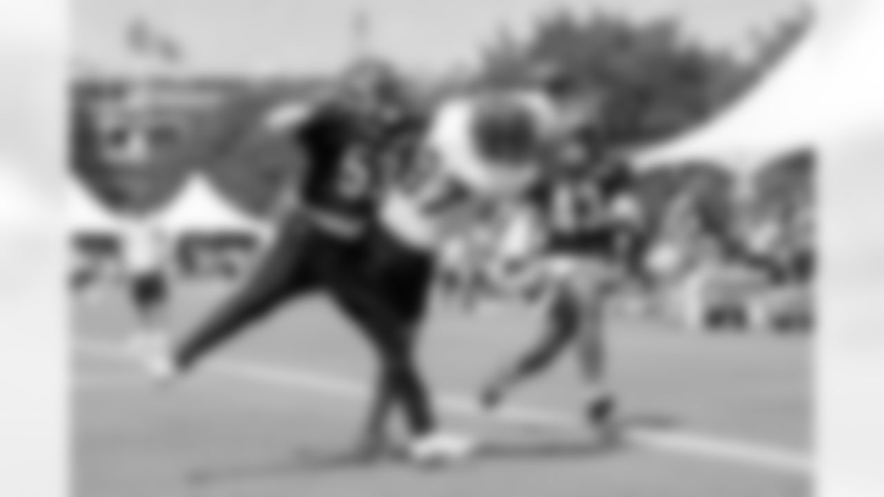 LB Joe Giles-Harris breaks up a pass intended for TE Tanner Hudson during training camp at Kettering Health Practice Fields, Friday, July 25, 2025.