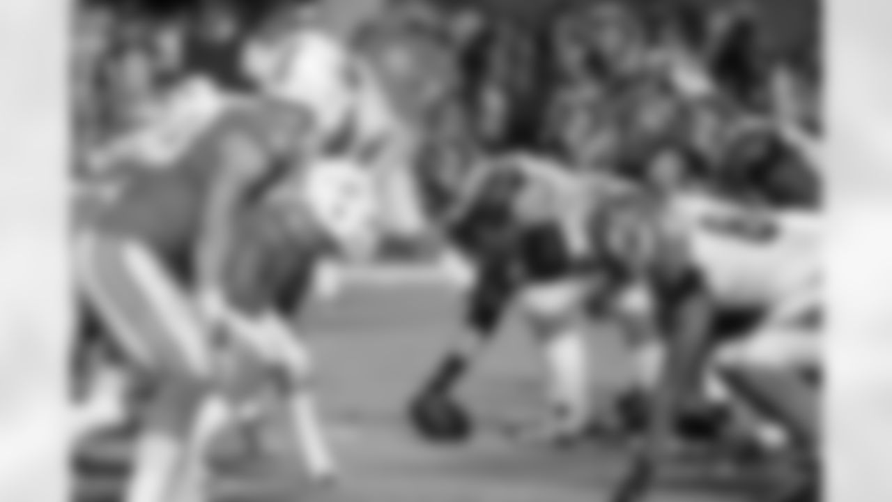 The Cincinnati Bengals offensive line gets set to snap the ball at the line of scrimmage opposite the Miami Dolphins defensive line during the NFL week 9 football game against the Miami Dolphins on Thursday, Oct. 31, 2013 in Miami Gardens, Fla.. The Dolphins won the game 22-20 in overtime. (AP Photo/Paul Spinelli)