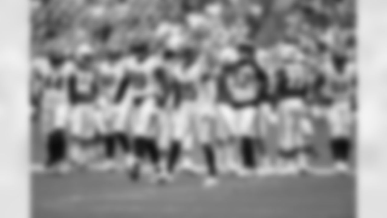 DE Myles Murphy and CB Jalen Davis celebrate a stop during Week 16 against the Miami Dolphins at Hard Rock Stadium, Sunday, Dec. 21, 2025.