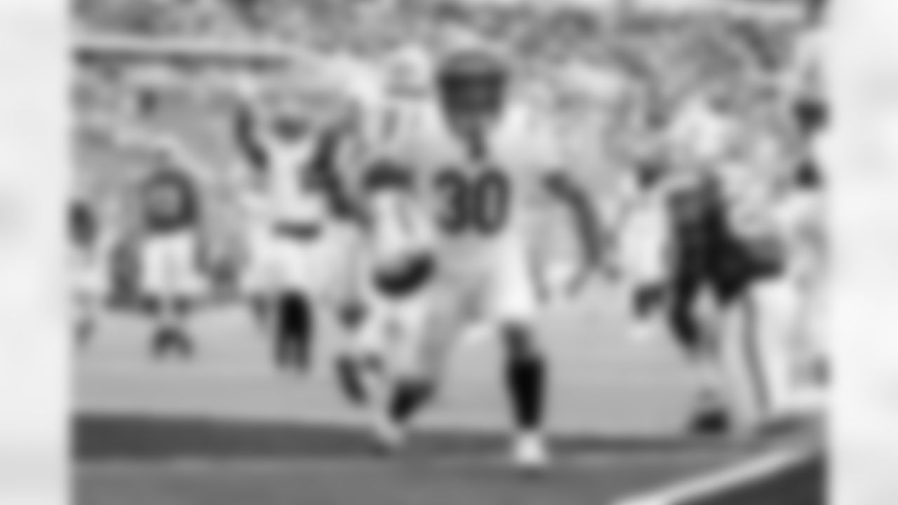 RB Chase Brown celebrates a touchdown during Week 16 against the Miami Dolphins at Hard Rock Stadium, Sunday, Dec. 21, 2025.