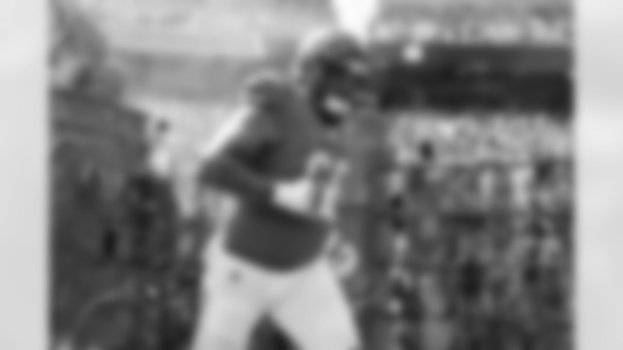 G Dalton Risner runs out of the tunnel ahead of Week 2 against the Jacksonville Jaguars at Paycor Stadium, Sunday, Sept. 14, 2025.