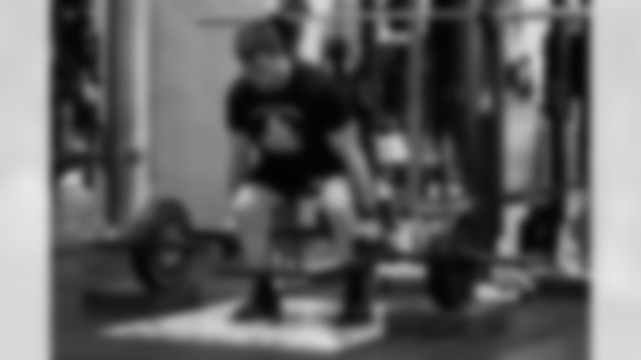 TE Cam Grandy lifts weights during phase one of offseason training at Paycor Stadium, Tuesday, April 22, 2025.