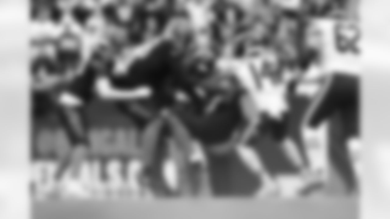 The Bengals combine for a tackle during Week 9 against the Chicago Bears at Paycor Stadium, Sunday, Nov. 2, 2025.