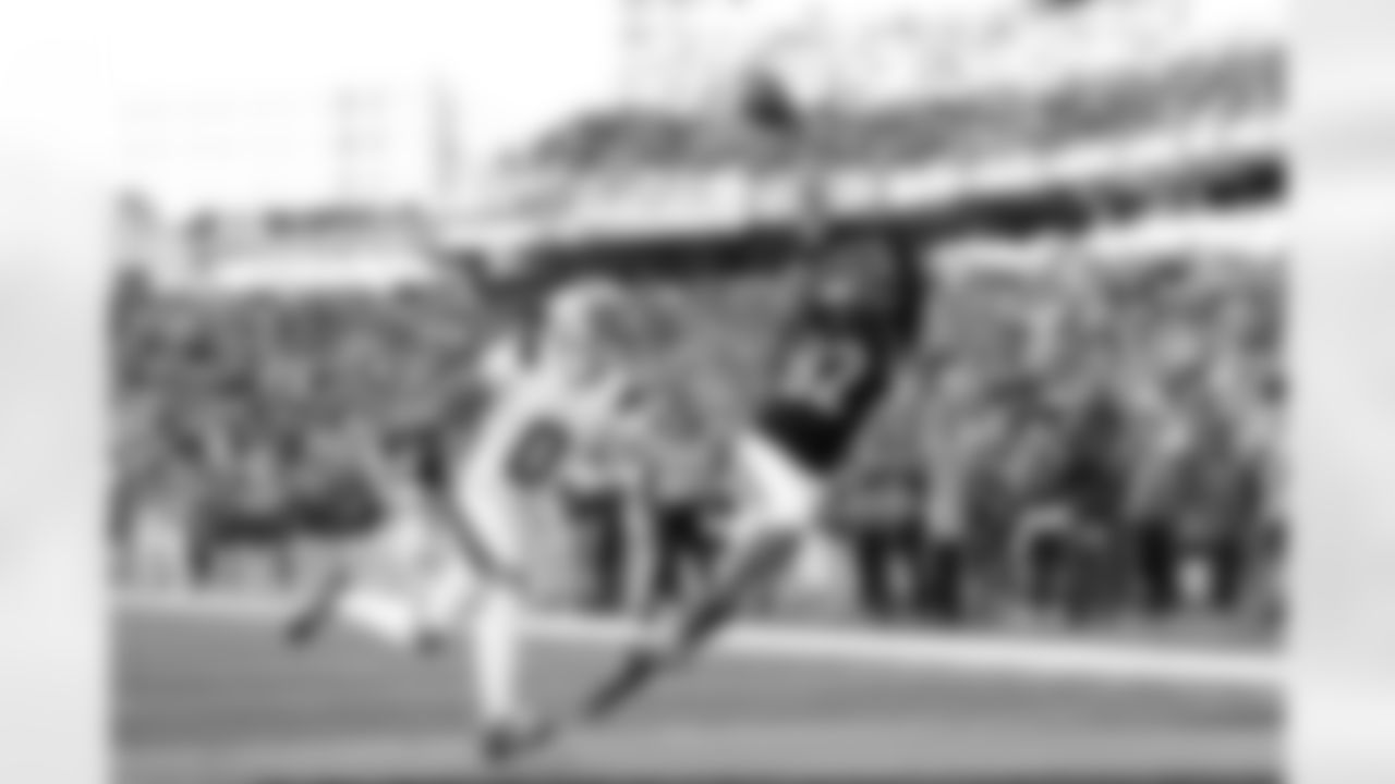 Cincinnati Bengals wide receiver Mitchell Tinsley (82) scores a touchdown during an NFL football game against the New England Patriots on Sunday, November 23, 2025 in Cincinnati, Ohio.