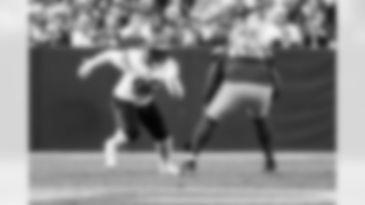 DE Cam Sample rushes a passer during Week 6 against the Packers in Green Bay, Sunday, Oct. 12, 2025.
