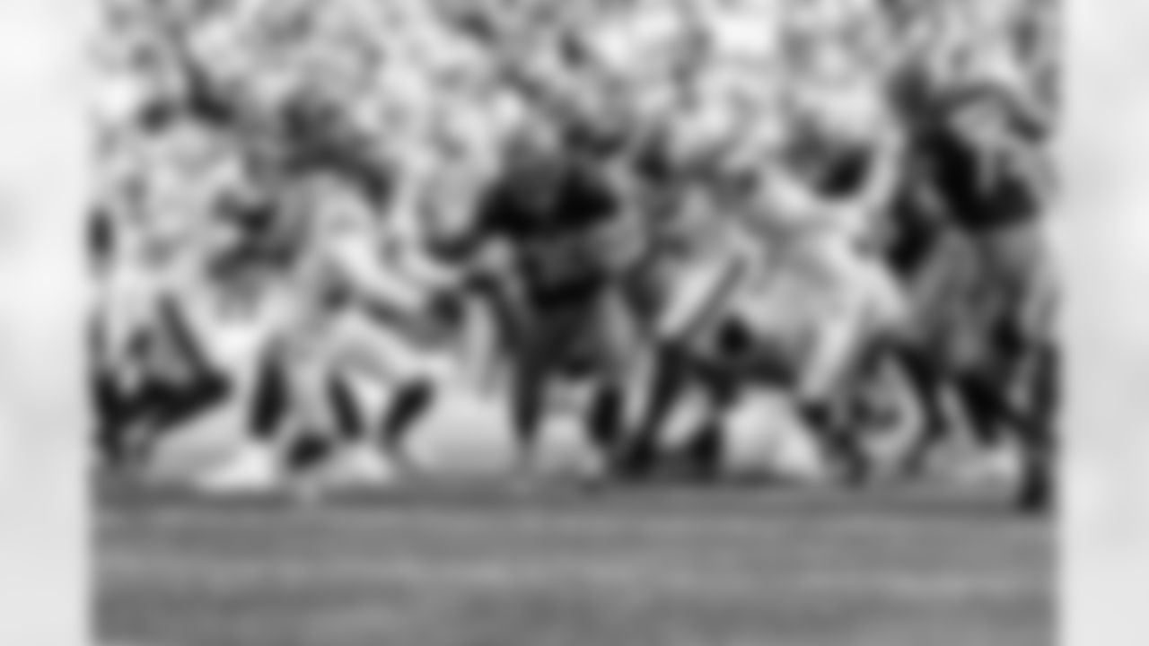 RB Chase Brown stiff arms a defender during Week 8 against the New York Jets, Sunday, Oct. 26, 2025