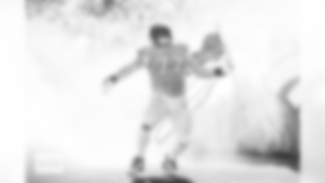 Denver Broncos guard Quinn Meinerz (77) runs out with an American flag during team and player introductions before the Broncos' Week 11 game against the Kansas City Chiefs at Empower Field at Mile High in Denver, Colorado on November 16, 2025. Photo by Ben Swanson / Denver Broncos