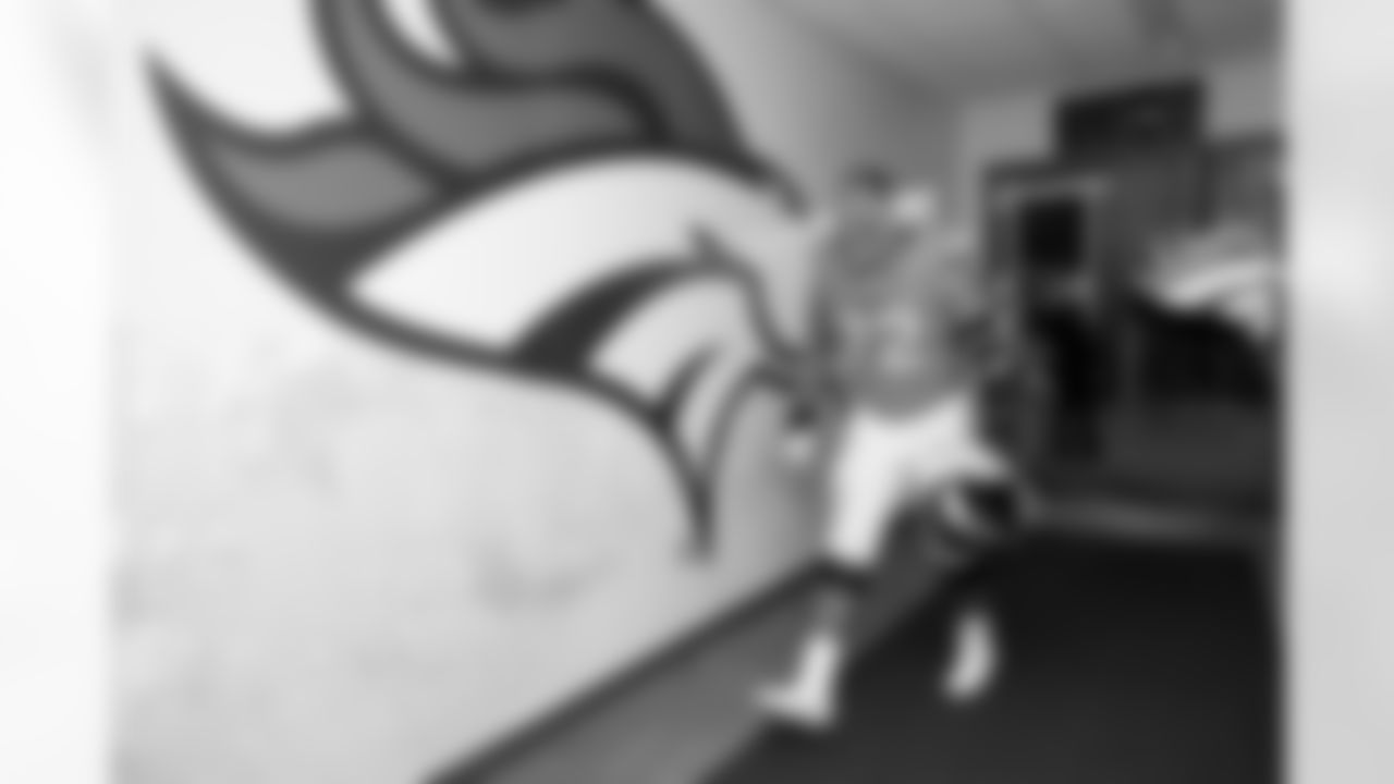 Denver Broncos offensive tackle Garett Bolles (72) celebrates in the locker room after the Broncos' Week 7 game against the New York Giants at Empower Field at Mile High in Denver, Colorado on October 19, 2025. Photo by Gabriel Christus / Denver Broncos